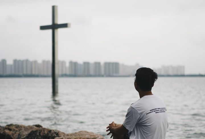 Man staring at the cross