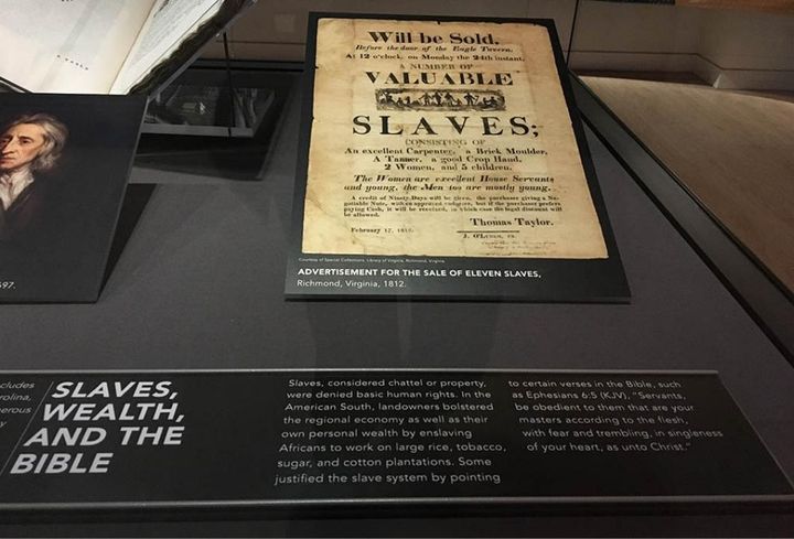Old Bible and slave posting in museum